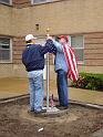 Gary & Marty place the new flag on the new flagpole